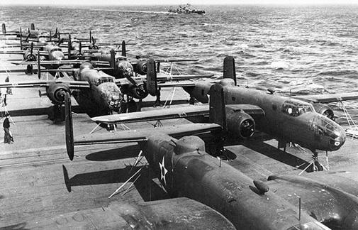 The B-25s were strapped down on the flight deck of the USS Hornet. They could not be stored in the ship’s hangar bay because the elevators were too small and could not support the weight of the bombers. Moreover, the internal space of the USS Hornet was already occupied by its own fighter aircraft, which were stowed below deck.